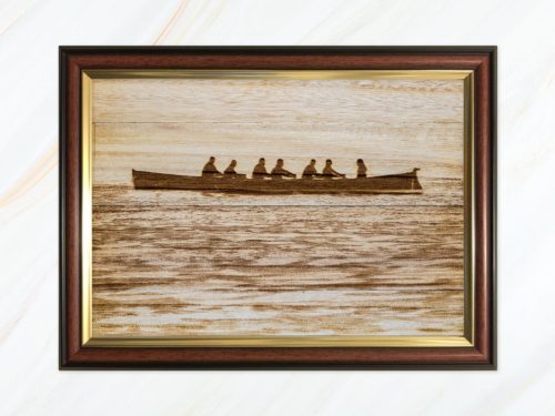 Wooden pyrograph of gig in calm waters