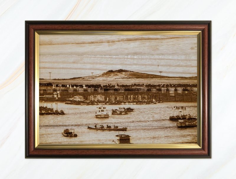 Wooden pyrograph of Samson and gigs rafting