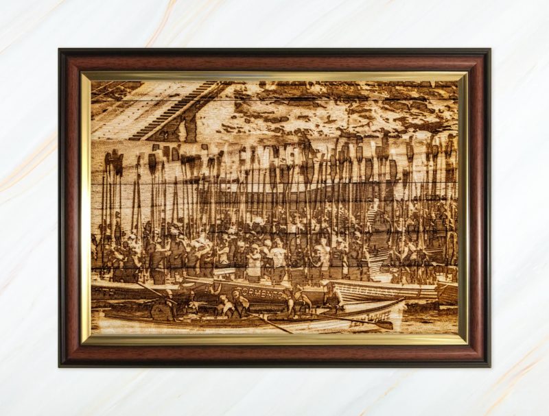 Wooden pyrograph of gigs rafting up