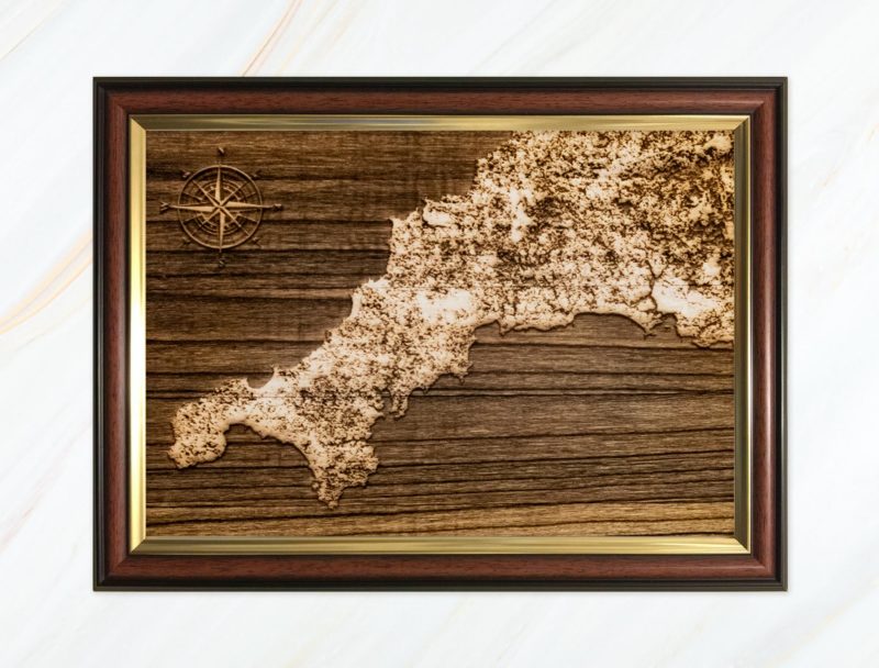Wooden pyrograph of map of Cornwall dark